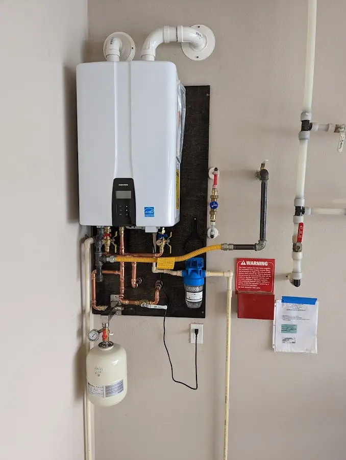 Professional plumber installing copper piping in a Chesterfield home